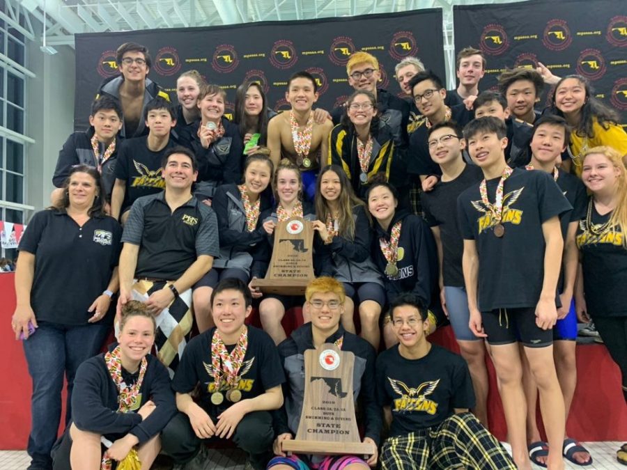 PHS swim team poses on podium after winning first place in Maryland State Class 2A/3A Championship meet. This marks the teams eighth consecutive win.