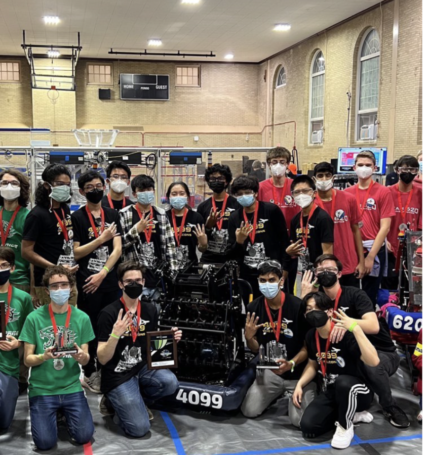 Team 4099 at their recent competition; Kabir located bottom right, directly next to the robot.
