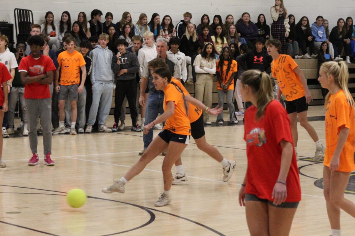 Senior Gabby Orns takes a penalty kick for team Meow against team Fast & Furious. 