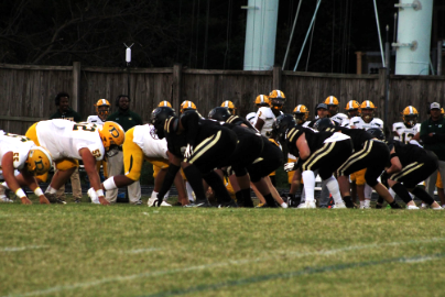 The Poolesville Falcons defense lines up to make a stop against Damascus