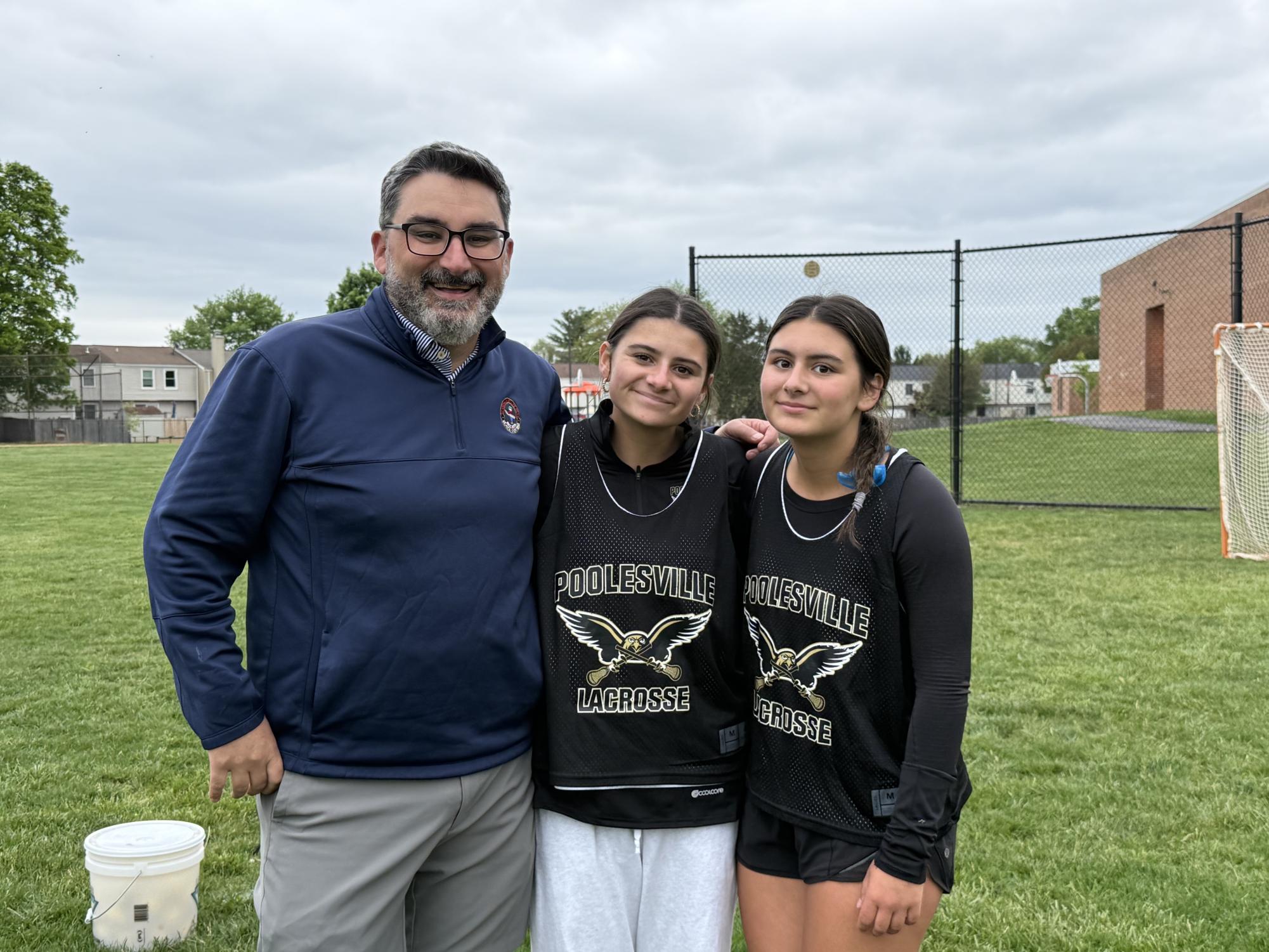 Coach Brian McGuire with daughters Victoria (center) and Zoe (right)
